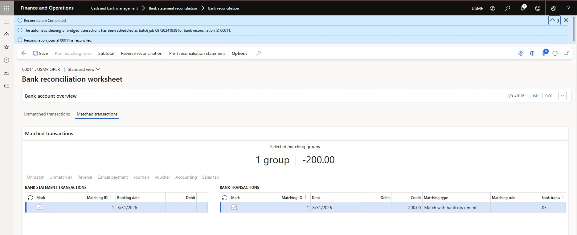 Bank reconciliation worksheet showing the Reconciliation Completed message and the scheduled automatic clearing batch job notification